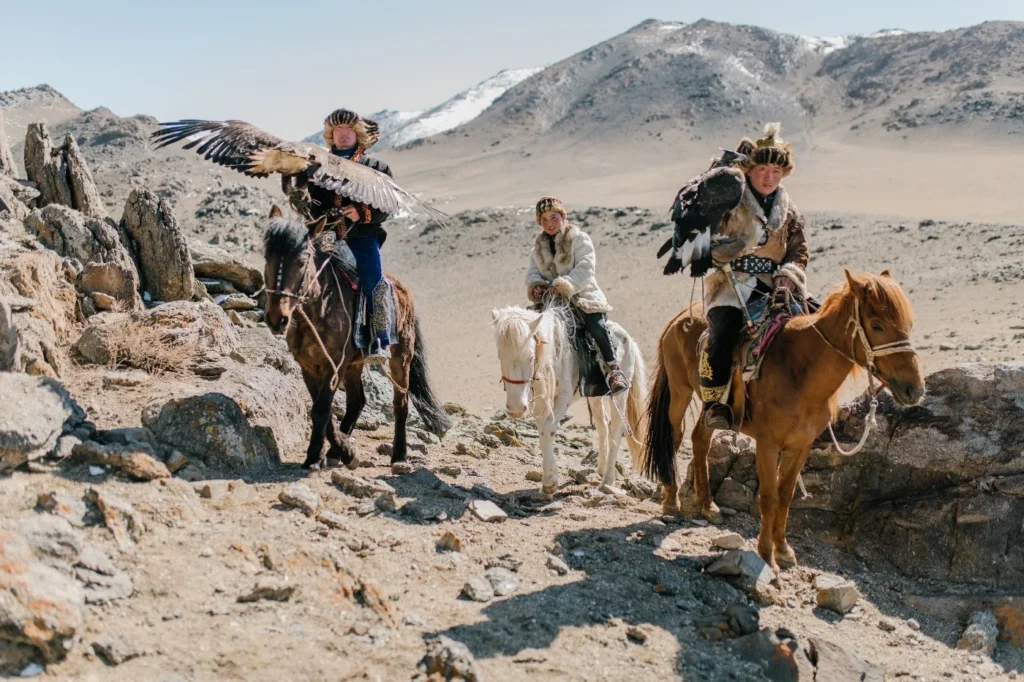 Eagle hunters on horseback