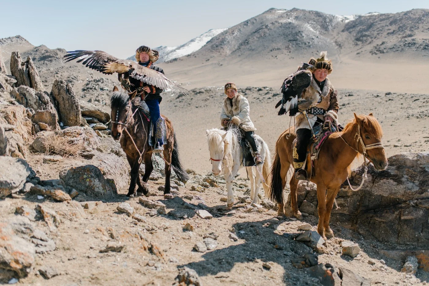 Eagle hunters on horseback